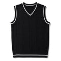 Man wearing black patchwork knit vest over a collared shirt