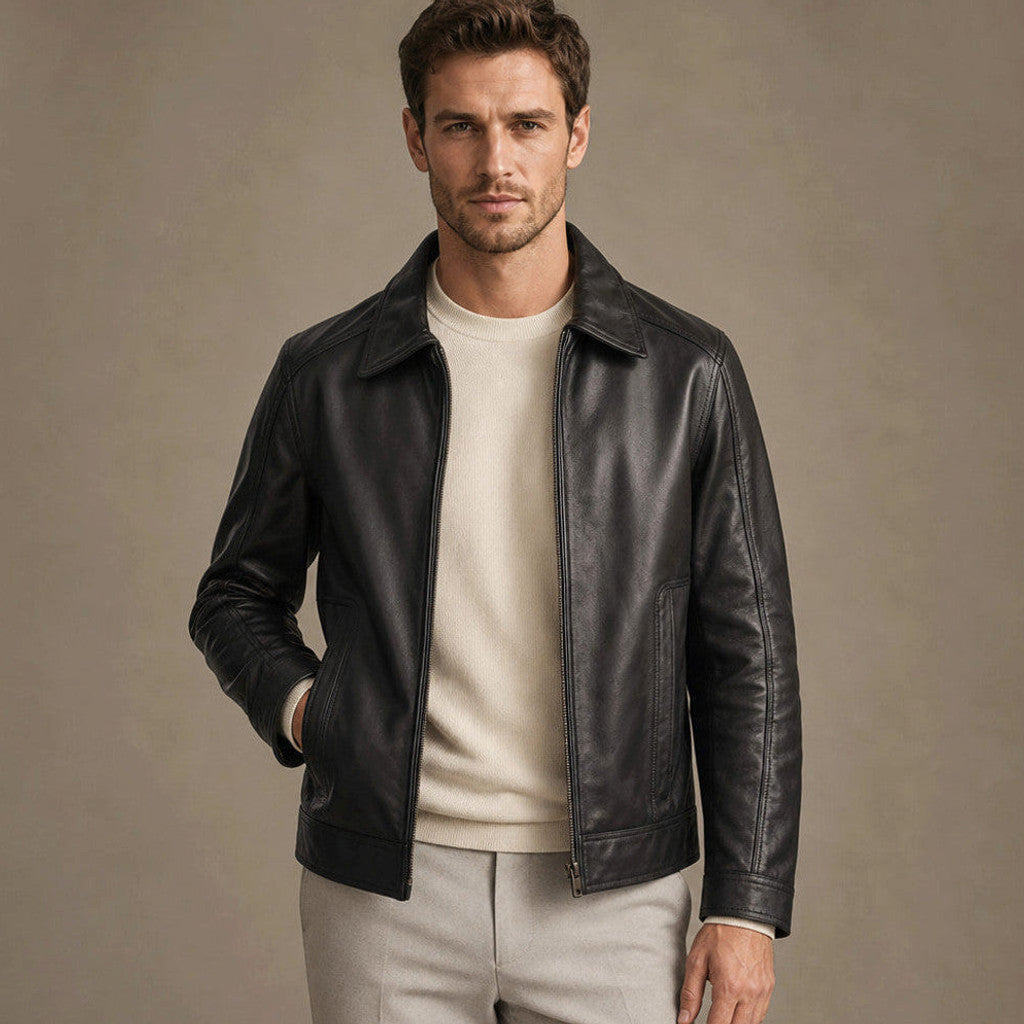 Man wearing a black sheepskin biker jacket over a knit with dark denim